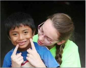Teaching a boy to smile on my mission trip since he has never taken a photo before! 